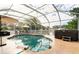 Relaxing screened-in pool area with a hot tub, perfect for outdoor entertaining and enjoying the Florida weather at 2460 Beacon Groves Blvd, Palm Harbor, FL 34683