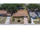 Birds eye view of a ranch style home with a nicely landscaped front yard and surrounding neighborhood at 2505 E 19Th Ave, Tampa, FL 33605