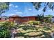 Inviting backyard features a wooden gazebo, lush landscaping, and a well-maintained lawn at 2505 E 19Th Ave, Tampa, FL 33605