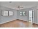 Bright bedroom with two windows, light blue paint, and sleek flooring, providing a serene atmosphere at 2505 E 19Th Ave, Tampa, FL 33605