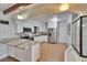 Updated kitchen featuring white cabinets, granite counters, stainless steel appliances, and wood look flooring at 2505 E 19Th Ave, Tampa, FL 33605