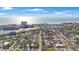 Stunning aerial view of a coastal neighborhood with a charming mix of homes, lush landscaping, and waterways at 280 41St Ave, St Pete Beach, FL 33706