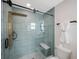 Stylish bathroom with a tiled shower, bench, and modern fixtures at 280 41St Ave, St Pete Beach, FL 33706