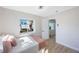 Airy bedroom with natural light, wood floors, and a serene view at 280 41St Ave, St Pete Beach, FL 33706