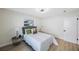 Well-lit bedroom with wood floors, ceiling fan, and simple design elements for a cozy feel at 280 41St Ave, St Pete Beach, FL 33706