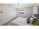 This bedroom boasts ample closet space, wood floors and a ceiling fan for added comfort at 280 41St Ave, St Pete Beach, FL 33706