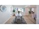 Open dining area with glass table, modern chairs, and bright natural light at 280 41St Ave, St Pete Beach, FL 33706