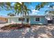 Charming light blue single-story home with tidy landscaping, new windows, and a one car garage at 280 41St Ave, St Pete Beach, FL 33706