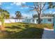 Inviting single-story home with a well-maintained lawn and a charming white privacy fence at 280 41St Ave, St Pete Beach, FL 33706