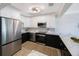 Updated kitchen with stainless steel appliances, white shaker cabinets, and a marble countertop at 280 41St Ave, St Pete Beach, FL 33706