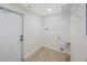 Clean laundry room with shelving, utility hookups, and light wood floors at 280 41St Ave, St Pete Beach, FL 33706
