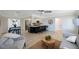 Bright open layout living room that flows into the kitchen area and features bar stool seating at 280 41St Ave, St Pete Beach, FL 33706