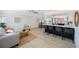 Open-concept living space with a kitchen featuring a breakfast bar and stainless steel appliances at 280 41St Ave, St Pete Beach, FL 33706