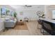 Spacious living room with a view of the backyard and dining table, and bar seating at the kitchen counter at 280 41St Ave, St Pete Beach, FL 33706