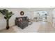 Inviting living room featuring a gray sectional, area rug, and decor at 280 41St Ave, St Pete Beach, FL 33706