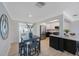 Cozy dining area near the remodeled kitchen with stainless steel appliances and adjacent living space at 280 41St Ave, St Pete Beach, FL 33706