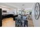 Open floor plan connecting the dining area, living room, and kitchen of this renovated home at 280 41St Ave, St Pete Beach, FL 33706