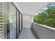 Outdoor balcony with railings and views of lush trees at 301 2Nd N St # 13, St Petersburg, FL 33701