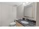Well-maintained bathroom featuring a vanity with a granite countertop, and modern fixture at 301 2Nd N St # 13, St Petersburg, FL 33701