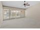 Bedroom featuring neutral walls, carpeted floors, ceiling fan, and sliding doors at 301 2Nd N St # 13, St Petersburg, FL 33701