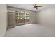 Bedroom featuring neutral walls, carpeted floors, ceiling fan, sliding doors to balcony at 301 2Nd N St # 13, St Petersburg, FL 33701