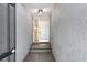 A private entrance with brick steps and modern lighting guides you to the front door at 301 2Nd N St # 13, St Petersburg, FL 33701