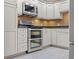 Updated kitchen with stainless steel appliances, granite countertops, and custom cabinetry at 301 2Nd N St # 13, St Petersburg, FL 33701