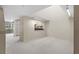 Spacious living room with neutral tones, new carpet, and unique natural lighting at 301 2Nd N St # 13, St Petersburg, FL 33701