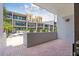 Private patio with brick flooring offers a relaxing outdoor living space with community views at 301 2Nd N St # 13, St Petersburg, FL 33701