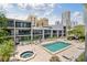 Condo complex featuring a community pool and spa at 301 2Nd N St # 13, St Petersburg, FL 33701