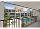 View of the community pool and spa from a balcony at 301 2Nd N St # 13, St Petersburg, FL 33701