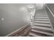 Hallway featuring wood-look floors and staircase with white risers at 3056 Pointeview Dr, Tampa, FL 33611