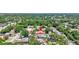 Expansive aerial view of a charming home nestled within a lush, green neighborhood at 3122 Lake Valencia E Ln, Palm Harbor, FL 34684