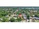 Stunning aerial perspective of a lovely home in a tree-lined community with a nearby lake at 3122 Lake Valencia E Ln, Palm Harbor, FL 34684