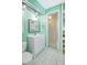 Bathroom featuring a stand up shower and light green colored walls at 3122 Lake Valencia E Ln, Palm Harbor, FL 34684