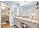Bathroom featuring a vanity with double sinks and a mirror at 3122 Lake Valencia E Ln, Palm Harbor, FL 34684