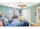 bedroom with ceiling fan, window, and white closet doors at 3122 Lake Valencia E Ln, Palm Harbor, FL 34684