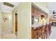 Bright eat-in kitchen with bar seating, granite countertops, and wood cabinets at 3122 Lake Valencia E Ln, Palm Harbor, FL 34684