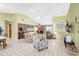Bright, open living room with a fireplace and seamless flow into the kitchen at 3122 Lake Valencia E Ln, Palm Harbor, FL 34684