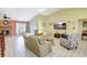 Spacious living room featuring tile floors, a fireplace, and plenty of natural light at 3122 Lake Valencia E Ln, Palm Harbor, FL 34684