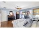 Spacious main bedroom featuring hardwood floors and a sliding glass door to the patio at 3122 Lake Valencia E Ln, Palm Harbor, FL 34684