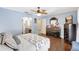 Charming main bedroom with hardwood floors and ensuite bathroom access at 3122 Lake Valencia E Ln, Palm Harbor, FL 34684