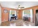 Bright office with two desk spaces, wood flooring, and natural light from two windows at 3122 Lake Valencia E Ln, Palm Harbor, FL 34684