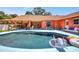 A beautiful pool deck with lots of plants. The backyard also has shade and lounge chairs at 3122 Lake Valencia E Ln, Palm Harbor, FL 34684