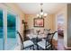 Bright eat-in kitchen area with a view to the backyard and access to other rooms at 3139 Corona Dr, Holiday, FL 34690