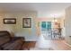 Comfortable dining room with sliding glass doors, hardwood floors, and easy backyard access at 3139 Corona Dr, Holiday, FL 34690