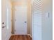 Entryway with hardwood floors, white doors, and neutral wall color, creating a welcoming space at 3139 Corona Dr, Holiday, FL 34690