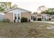 Inviting single-story home featuring unique stone details and a well-manicured front lawn at 3139 Corona Dr, Holiday, FL 34690