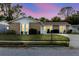 Charming single-story home with stone accents, lush landscaping, and well-lit windows at 3139 Corona Dr, Holiday, FL 34690