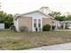 Single-story home showcasing unique stone siding and well-maintained landscaping at 3139 Corona Dr, Holiday, FL 34690